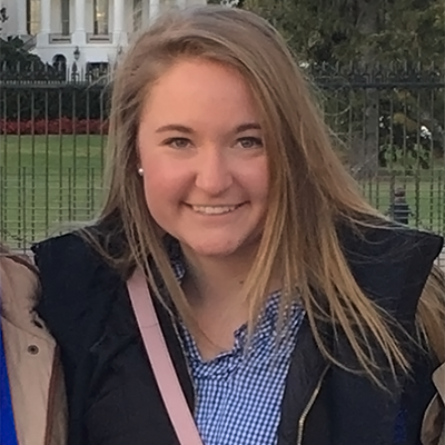 Internship Spotlight: Michaela Mineer stands in front of the White House